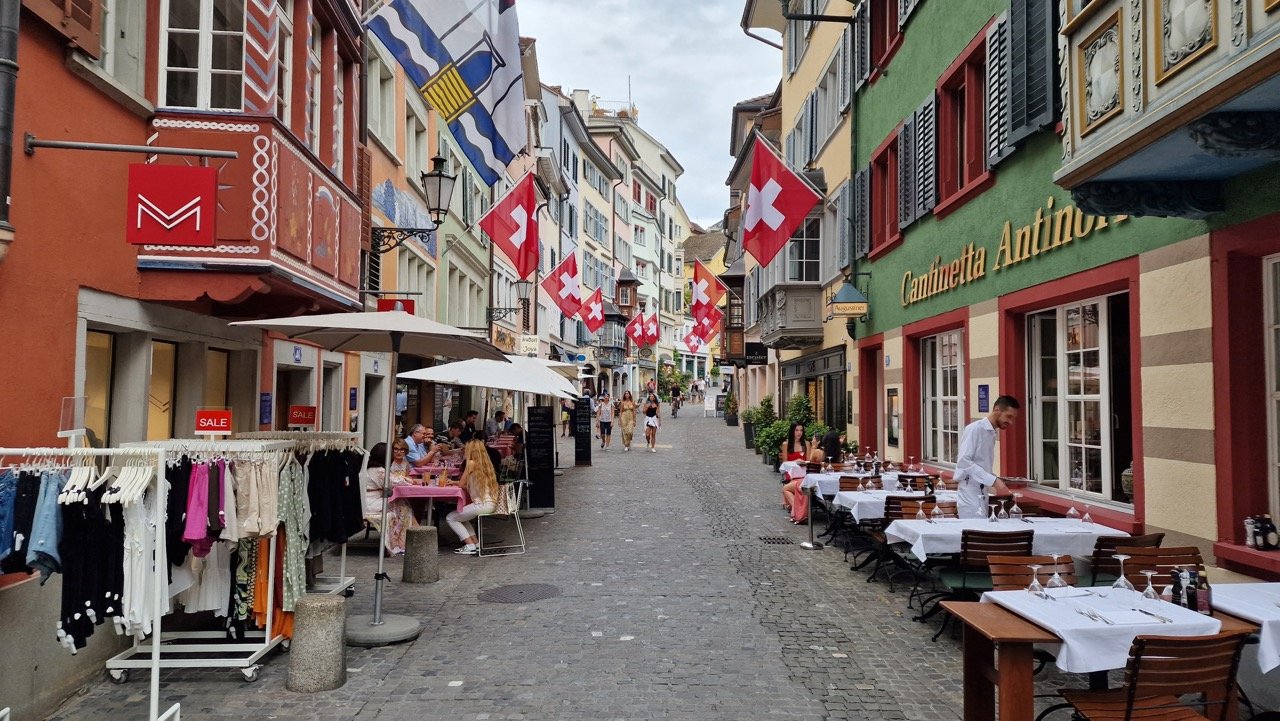 Zürich street with Swiss flags